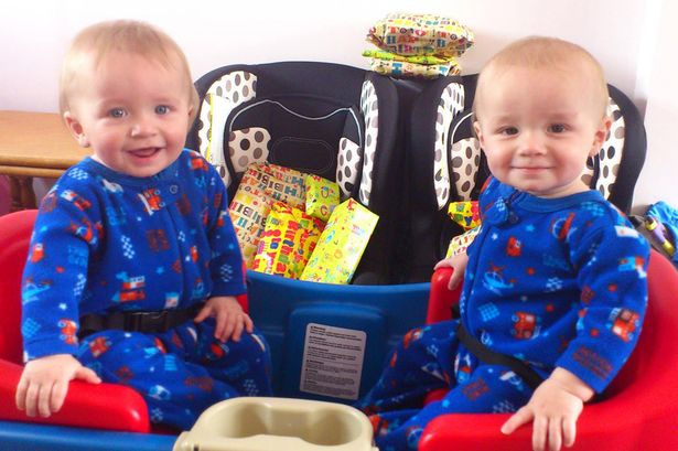 PAY-Logan-Symonds-right-with-twin-Alfie-left-both-dressed-as-boys-on-their-first-birthday