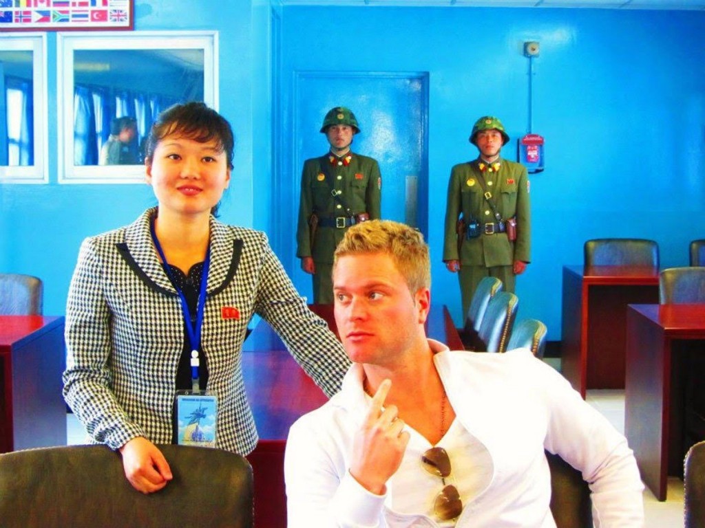 despite-this-they-were-able-to-talk-the-guards-into-allowing-them-inside-one-of-the-blue-huts-south-korea-begins-just-behind-the-last-two-guards-pictured-here-behind-justin