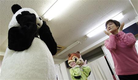 Choko Oohira teaches trainees in character mascots at the Choko Group mascot school in Tokyo