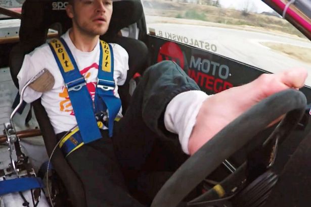 PAY-Bartek-Ostalowski-drives-his-racing-car-with-his-feet