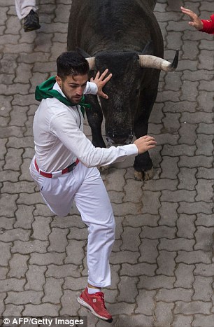 36187CBE00000578-3682545-The_best_known_running_of_the_bulls_is_held_each_year_in_Pamplon-a-140_1468102426165