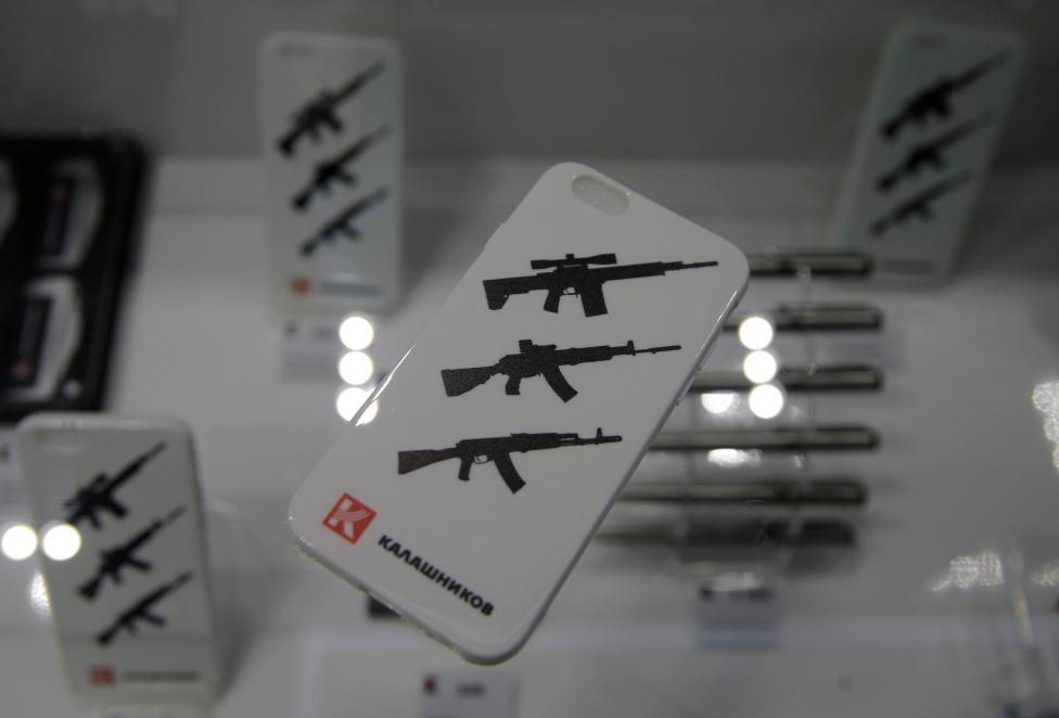 Mobile phone covers depicting assault rifles produced by the gunmaker Kalashnikov are pictured at the company's newly opened souvenir store in Moscow's Sheremetyevo airport