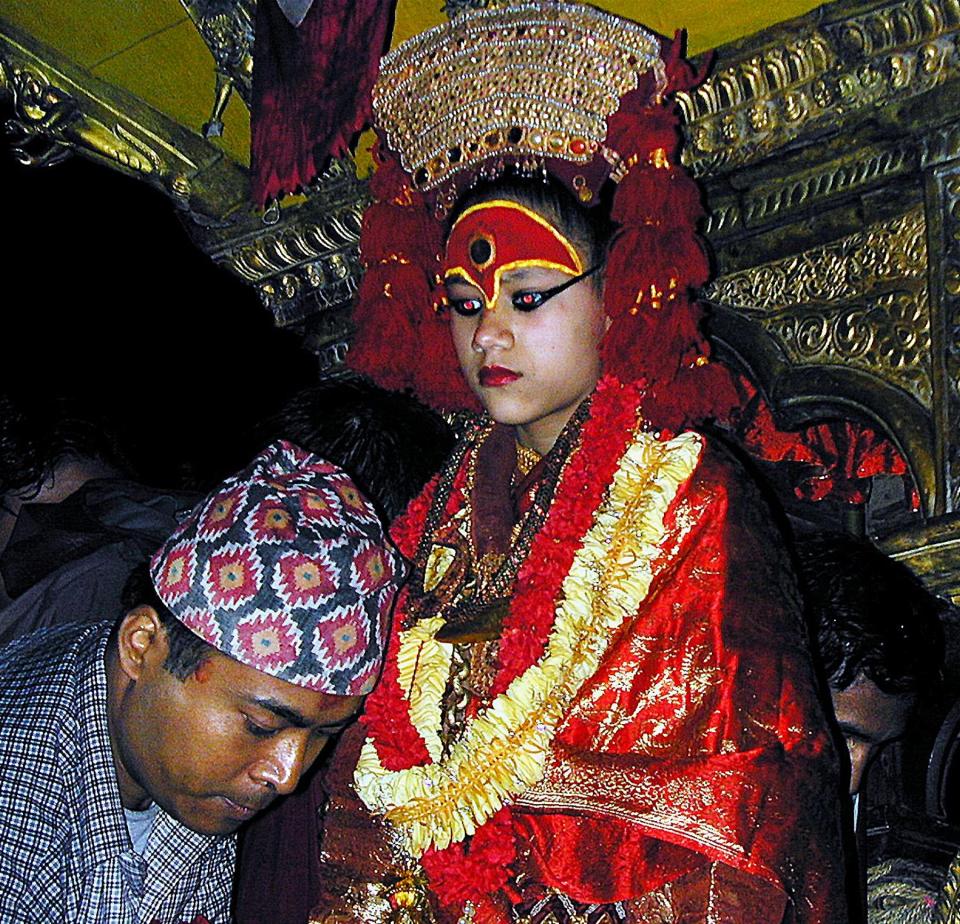 Kumari (C), considered a "living goddess