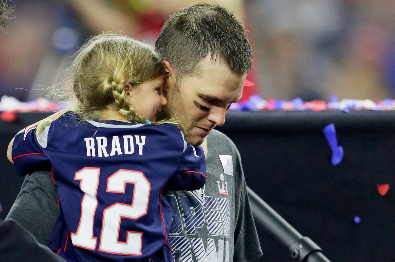 HOUSTON, TX - FEBRUARY 05: Tom Brady #12 of the New England Patriots celebrates with his daughter Vivian after defeating the Atlanta Falcons 34-28 in overtime to win Super Bowl 51 at NRG Stadium on February 5, 2017 in Houston, Texas. (Photo by Jamie Squire/Getty Images)