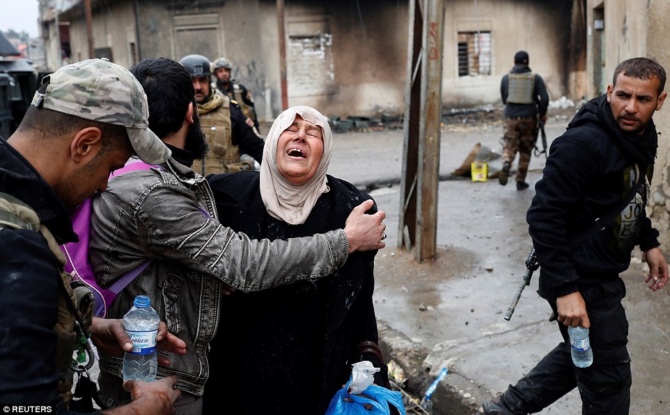 3DF8B7A700000578-4285270-A_woman_bursts_into_tears_after_crossing_from_an_ISIS_held_distr-a-173_1488792109109
