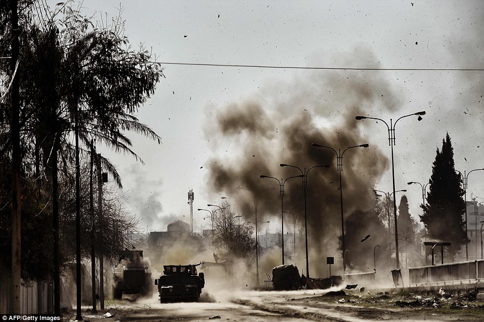 3DFBDB5B00000578-4285270-Smoke_billows_into_the_air_after_Iraqi_troops_blew_up_an_ISIS_un-a-162_1488792108598