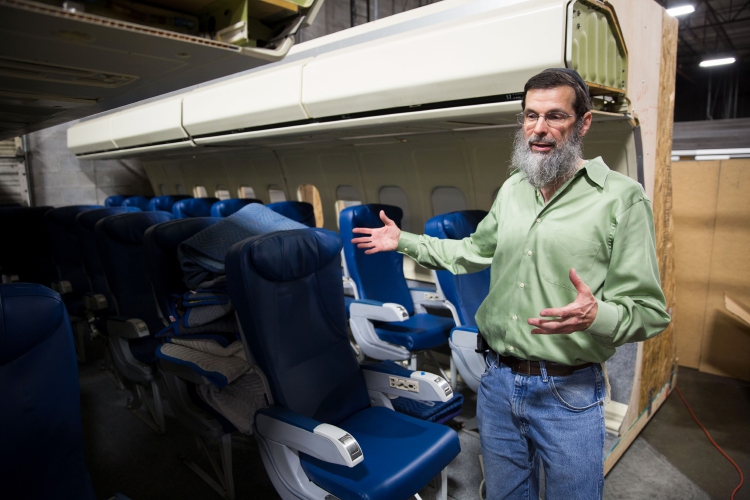 Rich "RJ" Rappaport shows part of a prop airplane interior. MUST CREDIT: Photo for The Washington Post by Kevin D. Liles