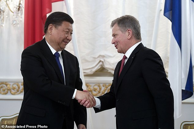 CAPTION CORRECTS THE DATE - Finland's President Sauli Niinist, right, and China's President Xi Jinping shake hands during a signing ceremony at the Presidential Palace in Helsinki, Wednesday, April 5, 2017. The Chinese President is on a state visit to Finland until Thursday. (Vesa Moilanen/Lehtikuva via AP)
