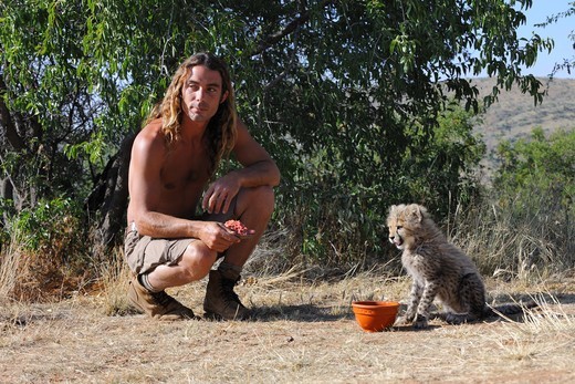 Olivier Houalet with a Cheetah of one month old Namibia