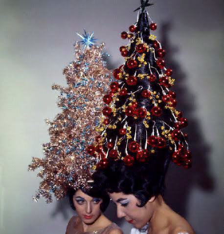 ca. 1961 --- Two young women display their holiday hairdos, each with 42-inch hair decorated with tinsel and ornaments. Claudette Ackrich's hair is decorated with tinsel, and Giselle Roc's hairstyle consists of Christmas tree balls. Both women have never had their hair cut. --- Image by © Bettmann/CORBIS