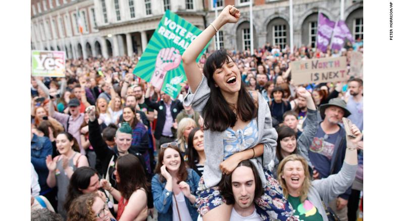 A woman from the "Yes" campaign reacts after the final result was announced in the Irish referendum on the 8th Amendment of the Irish Constitution at Dublin Castle, in Dublin, Ireland, Saturday, May 26, 2018. Ireland appeared to move away from its conservative Roman Catholic roots and embrace a more liberal view Friday as two major exit polls predicted voters had repealed a constitutional ban on abortion. (AP Photo/Peter Morrison)