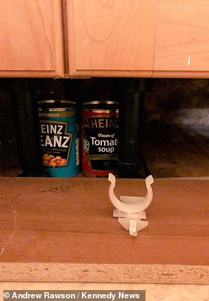 7980694-6593427-Mr_Rawson_hides_tins_of_food_under_cupboards_in_his_home-a-3_1547569886137