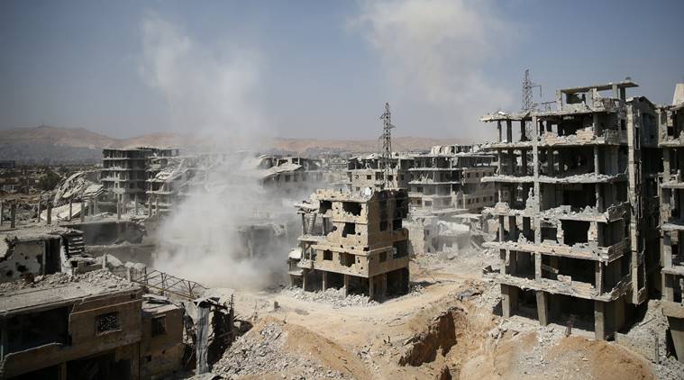 Smoke rises at a damaged site in Ain Tarma, eastern Damascus suburb of Ghouta, Syria, September 14, 2017. REUTERS/Bassam Khabieh