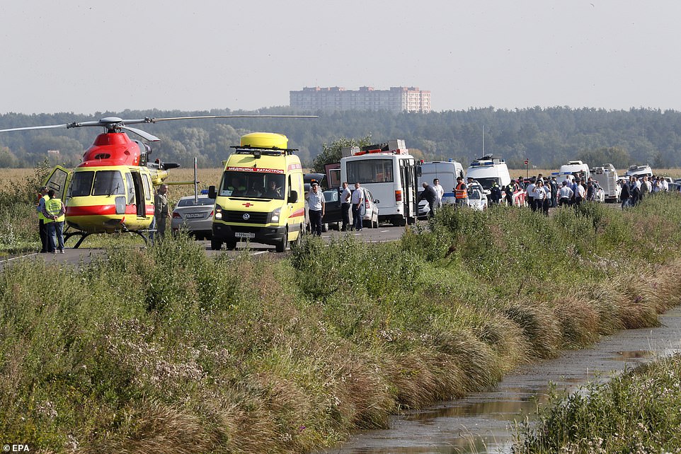 17303704-7361665-Ambulances_a_medical_helicopter_and_passing_vehicles_stop_to_hel-a-20_1565910306792