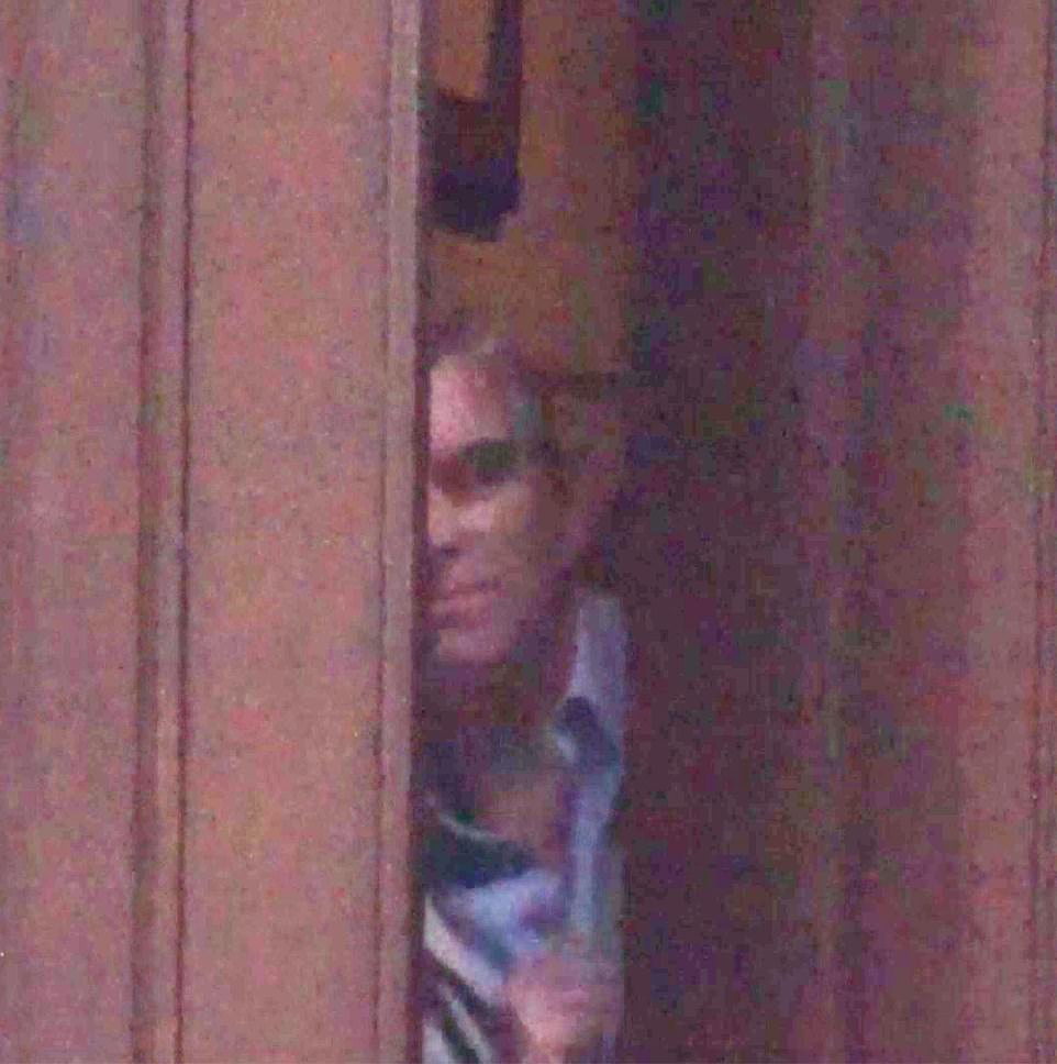 17395746-7367511-After_she_leaves_Andrew_pauses_to_peer_around_the_giant_oak_door-a-74_1566074566950