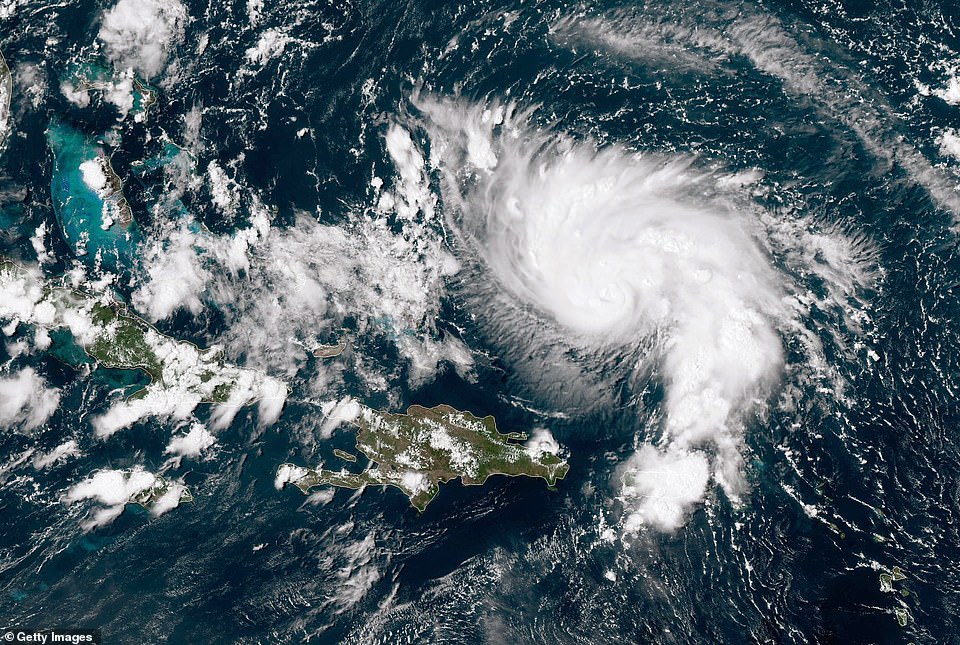 17848322-7416325-Hurricane_Dorian_is_pictured_Thursday_in_this_satellite_image_as-a-9_1567363381877