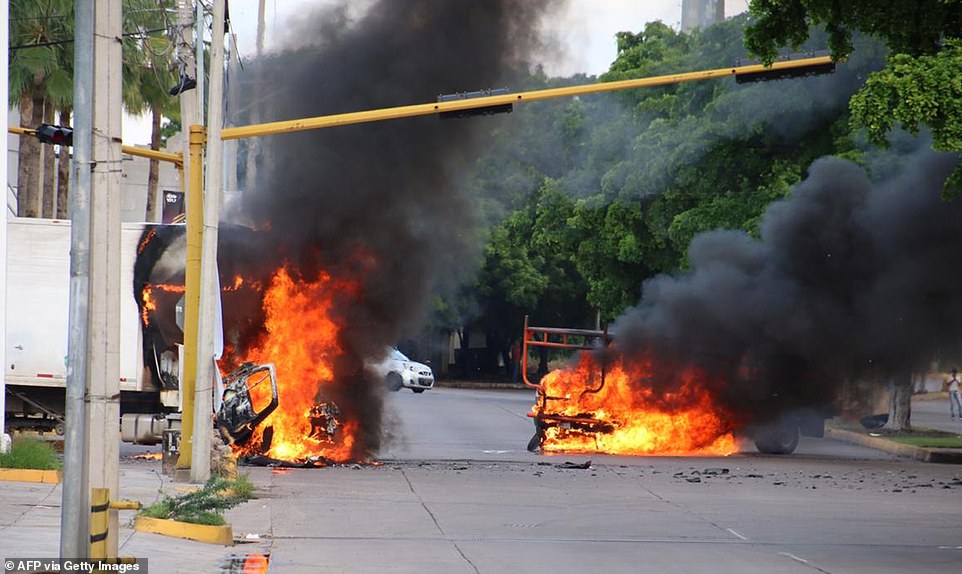 19884932-7588311-A_common_tactic_for_the_cartel_is_to_set_cars_on_fire_at_the_end-a-13_1571415123335