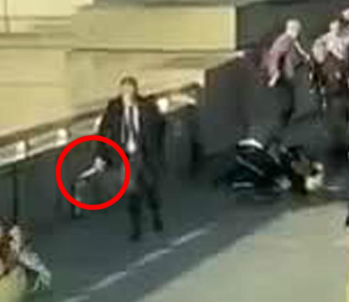 21622024-7739353-A_man_can_be_seen_holding_a_knife_circled_on_London_Bridge_durin-a-18_1575042417026