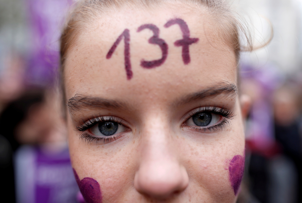People attend a demonstration to protest femicide and violence against women in Paris