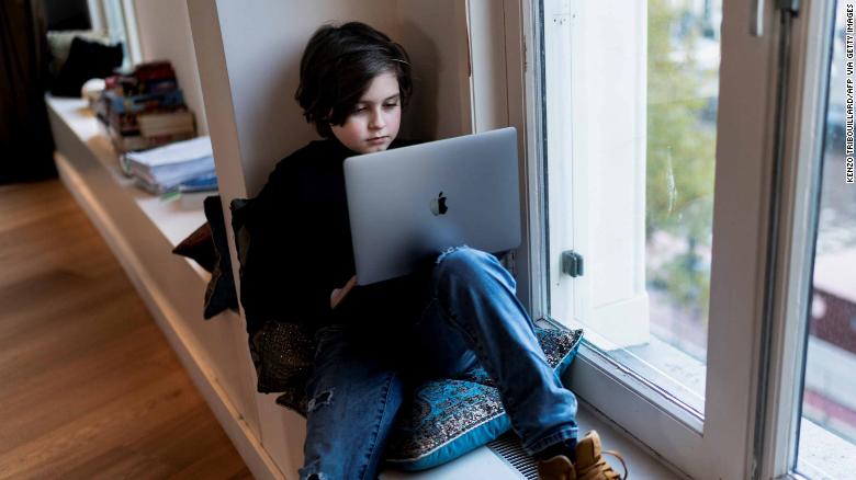 Belgian student Laurent Simons, 9 years old, poses during a photo session at his home on November 21, 2019 in Amsterdam. - Laurent Simons is studying electrical engineering at the Eindhoven University of Technology and is on course to finish his degree in December. (Photo by Kenzo TRIBOUILLARD / AFP) (Photo by KENZO TRIBOUILLARD/AFP via Getty Images)