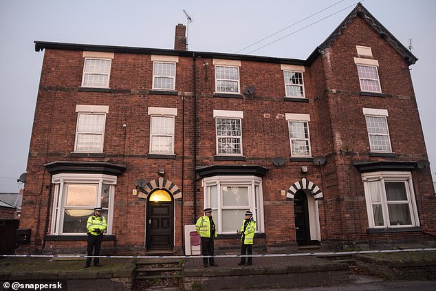 21644812-7742383-Staffordshire_police_officers_stand_guard_at_a_property_in_Staff-a-78_1575152778625