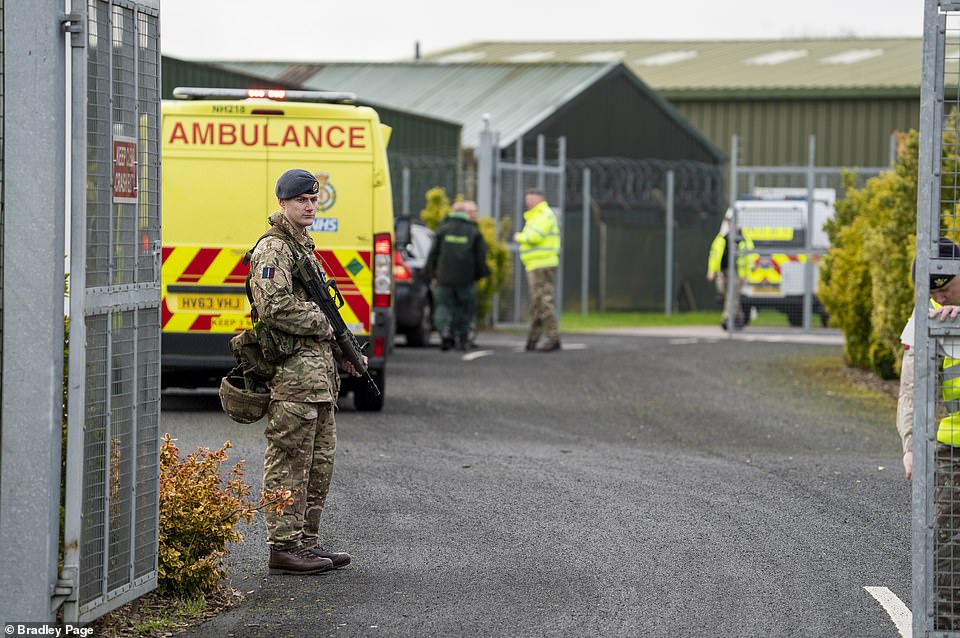 24121452-7952271-An_armed_soldier_stands_guard_at_RAF_Brize_Norton_this_morning-a-36_1580522894785
