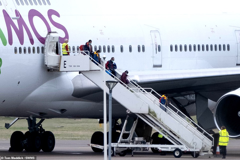 24129792-7952359-British_nationals_arrive_on_a_Boeing_747_at_RAF_Brize_Norton_in_-a-31_1580496413700