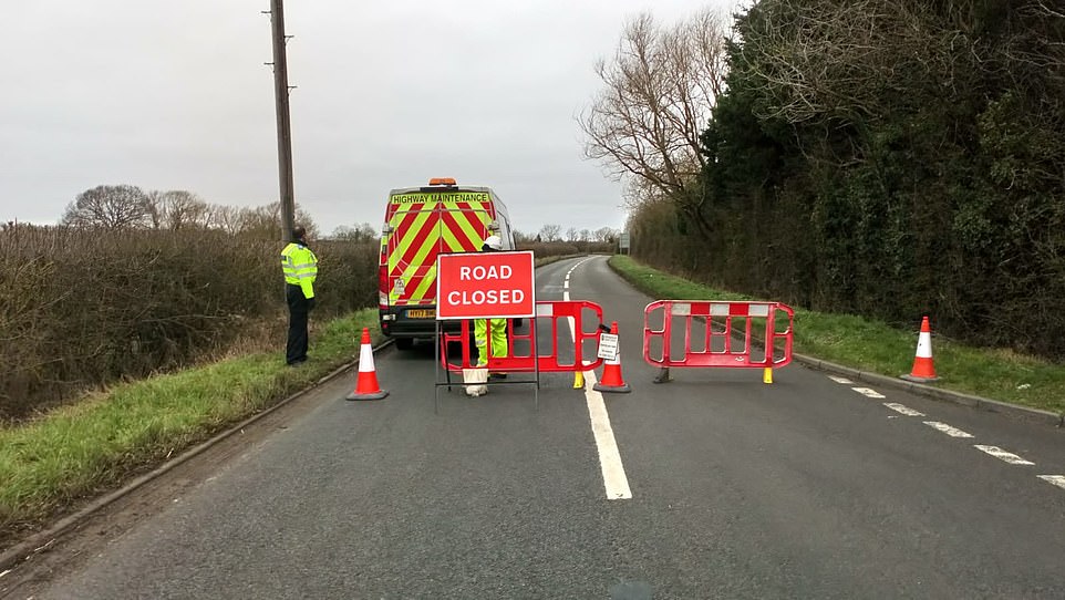 24130166-7952271-All_roads_into_Brize_Norton_village_have_been_closed_Police_set_-a-130_1580480738128