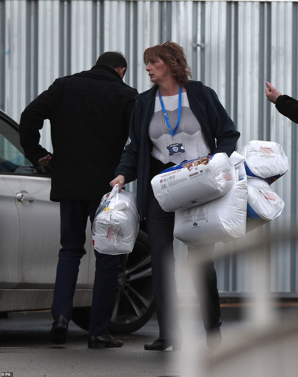 24135228-7952359-Bedding_is_unloaded_at_the_accommodation_at_Arrowe_Park_Hospital-a-37_1580496413703
