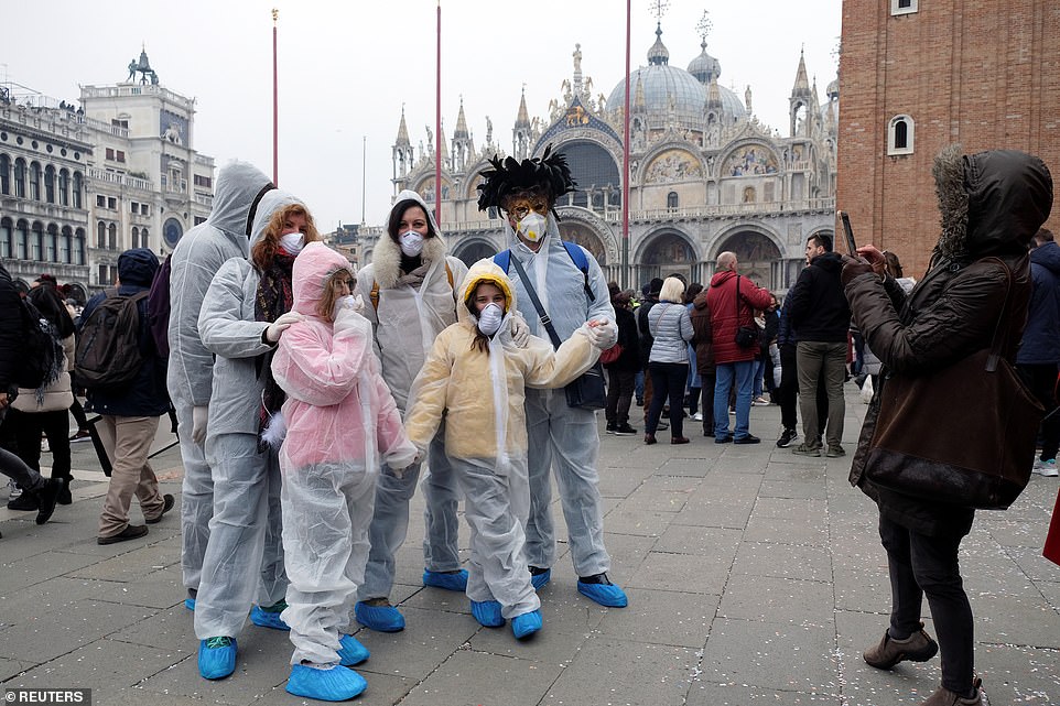 25089296-8034547-Carnival_revellers_wear_protective_face_masks_at_Venice_Carnival-a-42_1582501796719