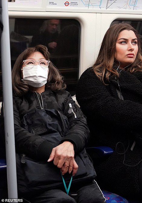 25281298-8055813-A_woman_wearing_a_protective_mask_travels_on_a_Jubilee_Line_tube-a-5_1582905695565