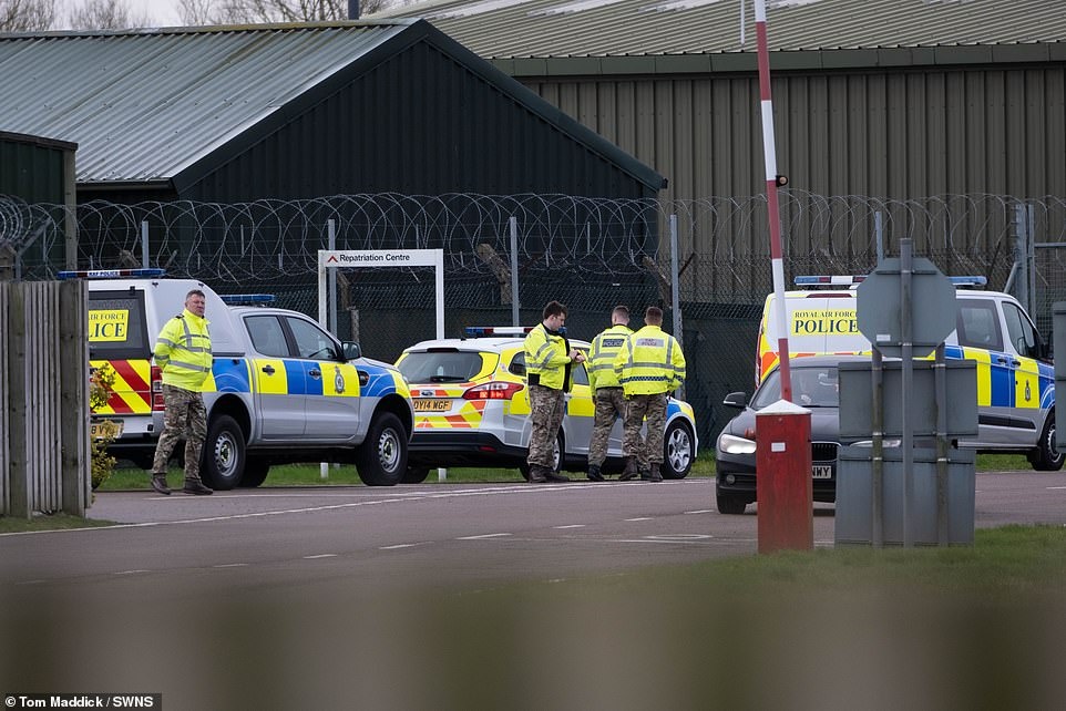 24120092-7951403-Ambulance_crews_arrive_at_RAF_Brize_Norton_in_Oxfordshire_this_m-a-7_1580465047481.jpg
