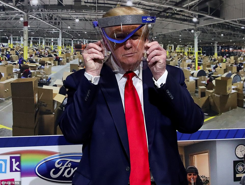 28677522-8345541-President_Trump_was_pictured_holding_up_a_plastic_face_covering-a-35_1590093701113