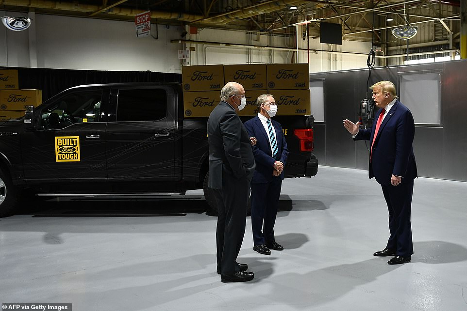 28678060-8345541-Ford_Motor_Company_CEO_Jim_Hackett_left_speaks_with_President_Do-a-48_1590093701284