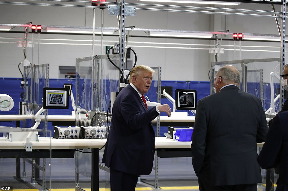 28681566-8346075-Vital_equipment_Donald_Trump_speaks_as_he_tours_Ford_s_Rawsonvil-a-3_1590115653915