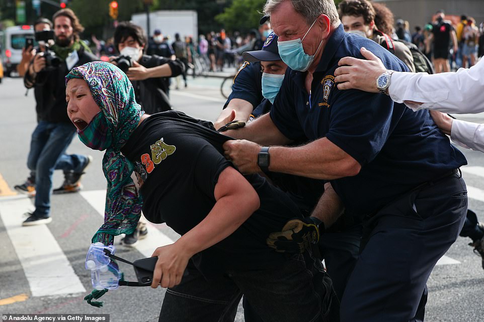 28954498-8367883-New_York_City_New_York_A_woman_is_one_of_around_70_people_arrest-a-52_1590741051919