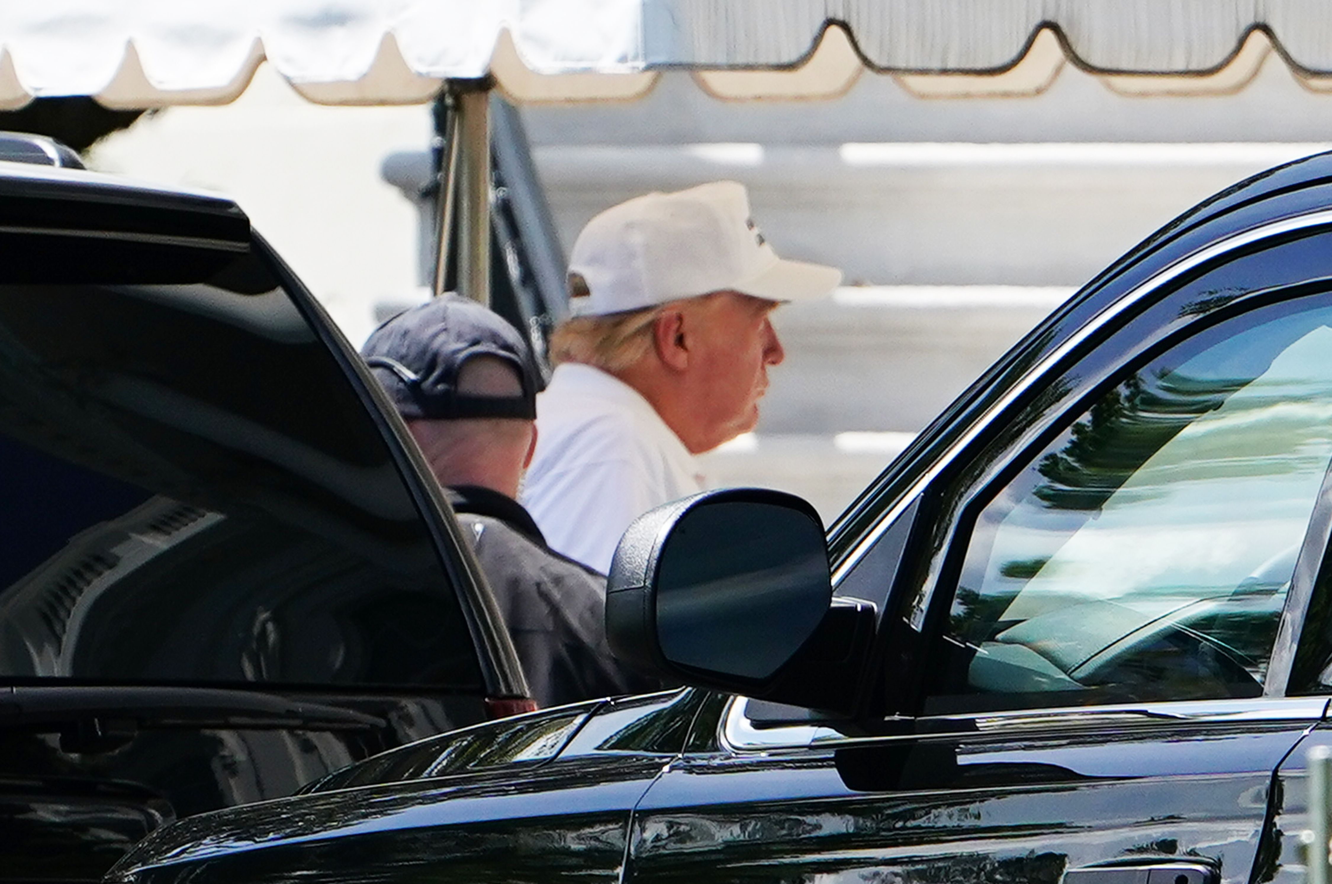 US President Donald Trump walks from a SUV upon return to the White House in Washington, DC on May 23, 2020. - Trump returned to the White House after spending the day at his Virginia golf club. (Photo by MANDEL NGAN / AFP) (Photo by MANDEL NGAN/AFP via Getty Images)