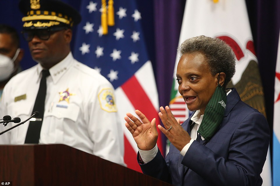 31784610-8611143-Mayor_Lori_Lightfoot_and_Chicago_Police_Supt_David_Brown_hold_a_-a-70_1597091793606.jpg