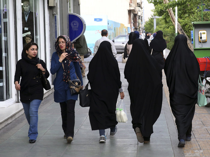 Women stroll on a Tehran street. Iranians are bracing themselves for extra scrutiny of their dress and behavior when a new, undercover morality police squad is deployed.