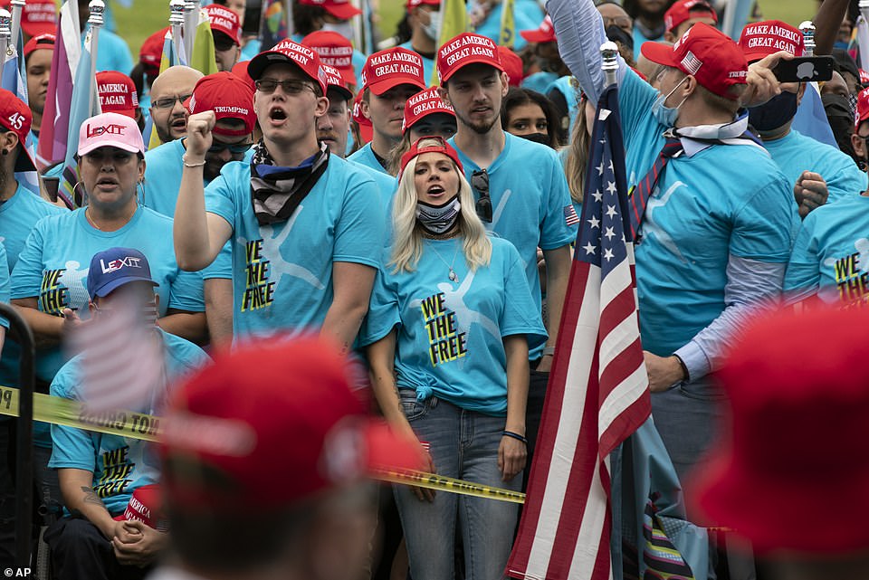 34232250-8826761-Hundreds_of_people_had_arrived_for_the_rally_around_an_hour_befo-a-4_1602372876431