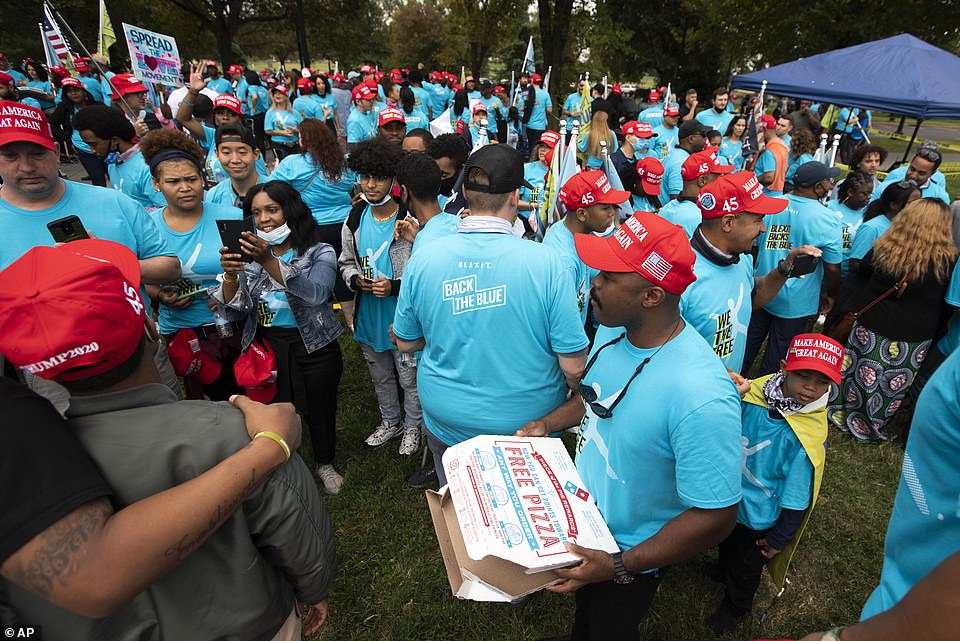 34233060-8826761-People_shared_pizza_and_shunned_masks_after_a_rally_at_The_Ellip-a-6_1602372876435